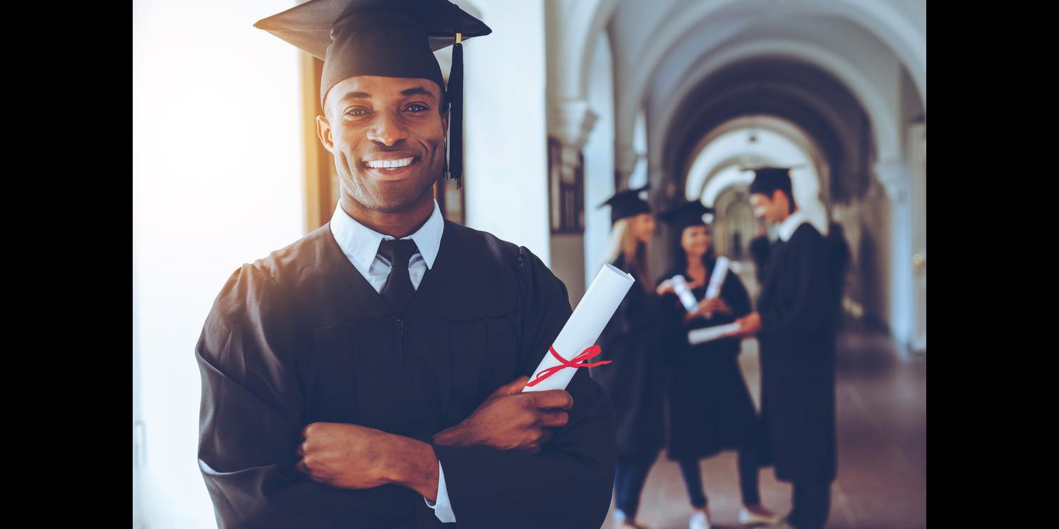Young Man Graduating College and Smiling